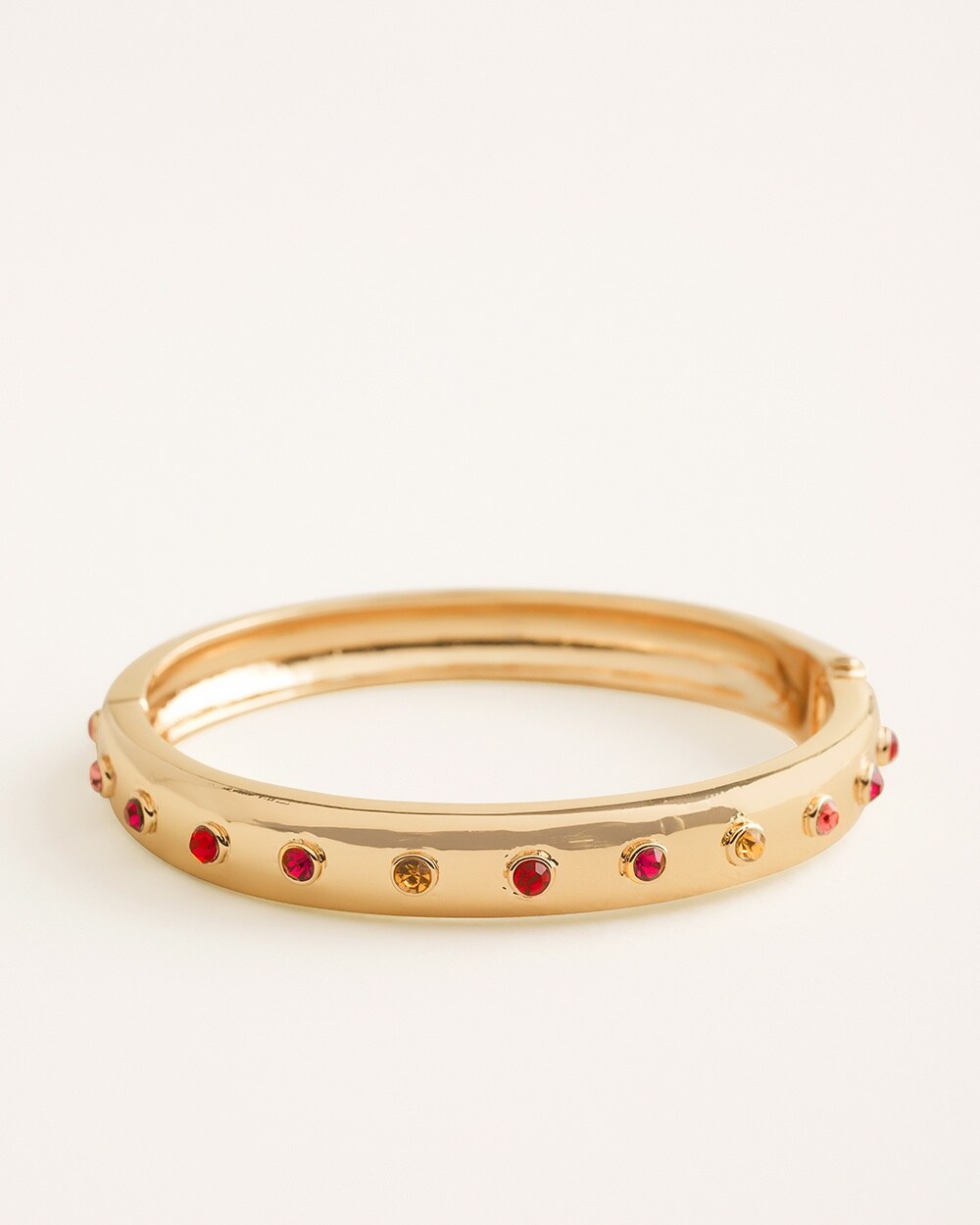Goldtone and Red Simulated Stone Hinged Bangle