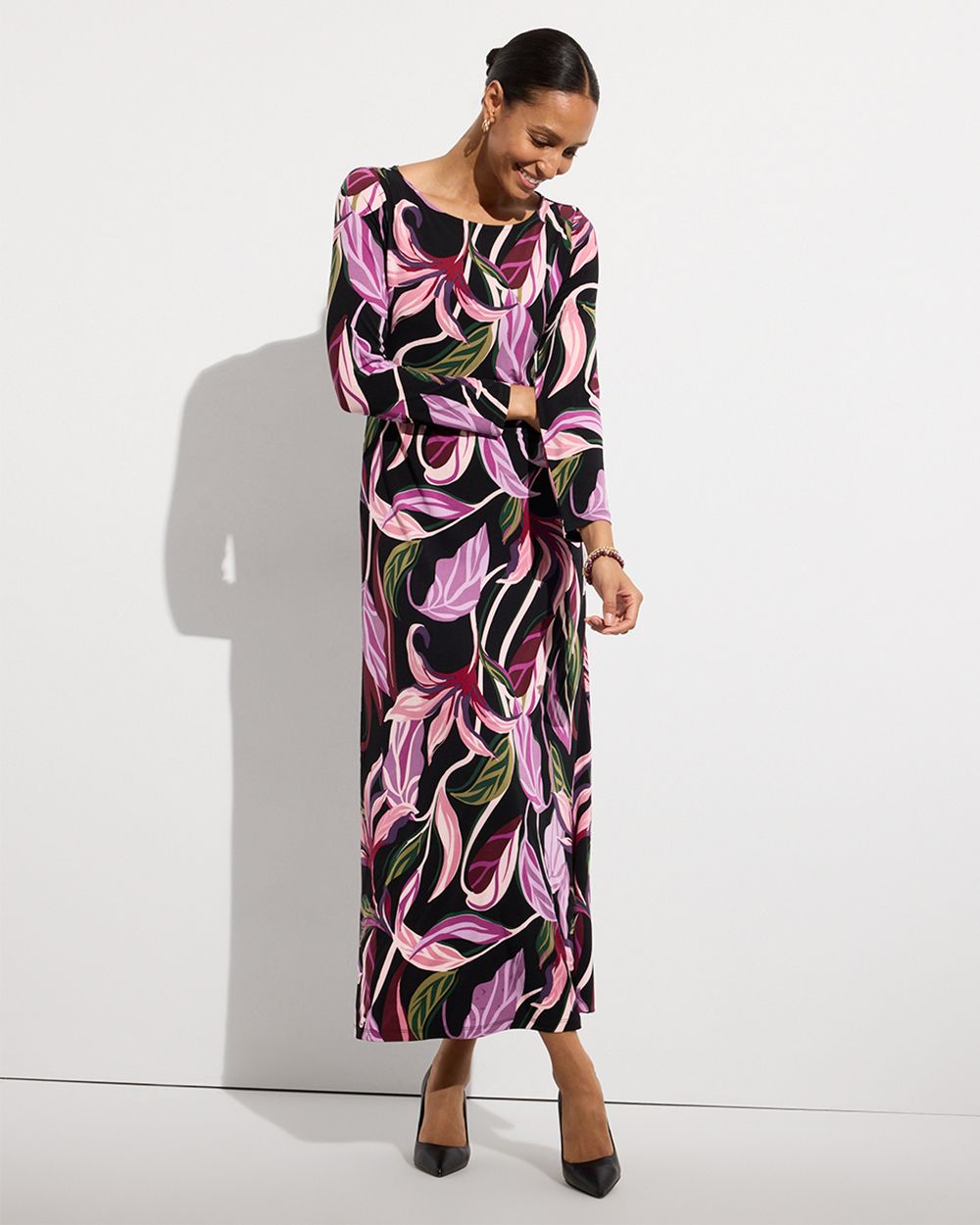 Woman wearing light purple and black swirled maxi dress
