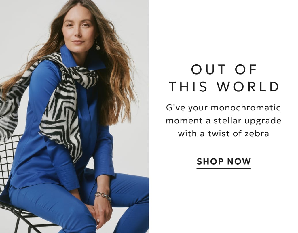 Woman wearing planetary blue outfit with zebra print scarf