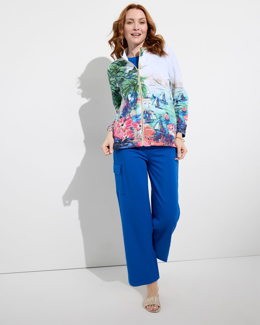Chico's Outlet woman wearing printed jacket with royal blue pants