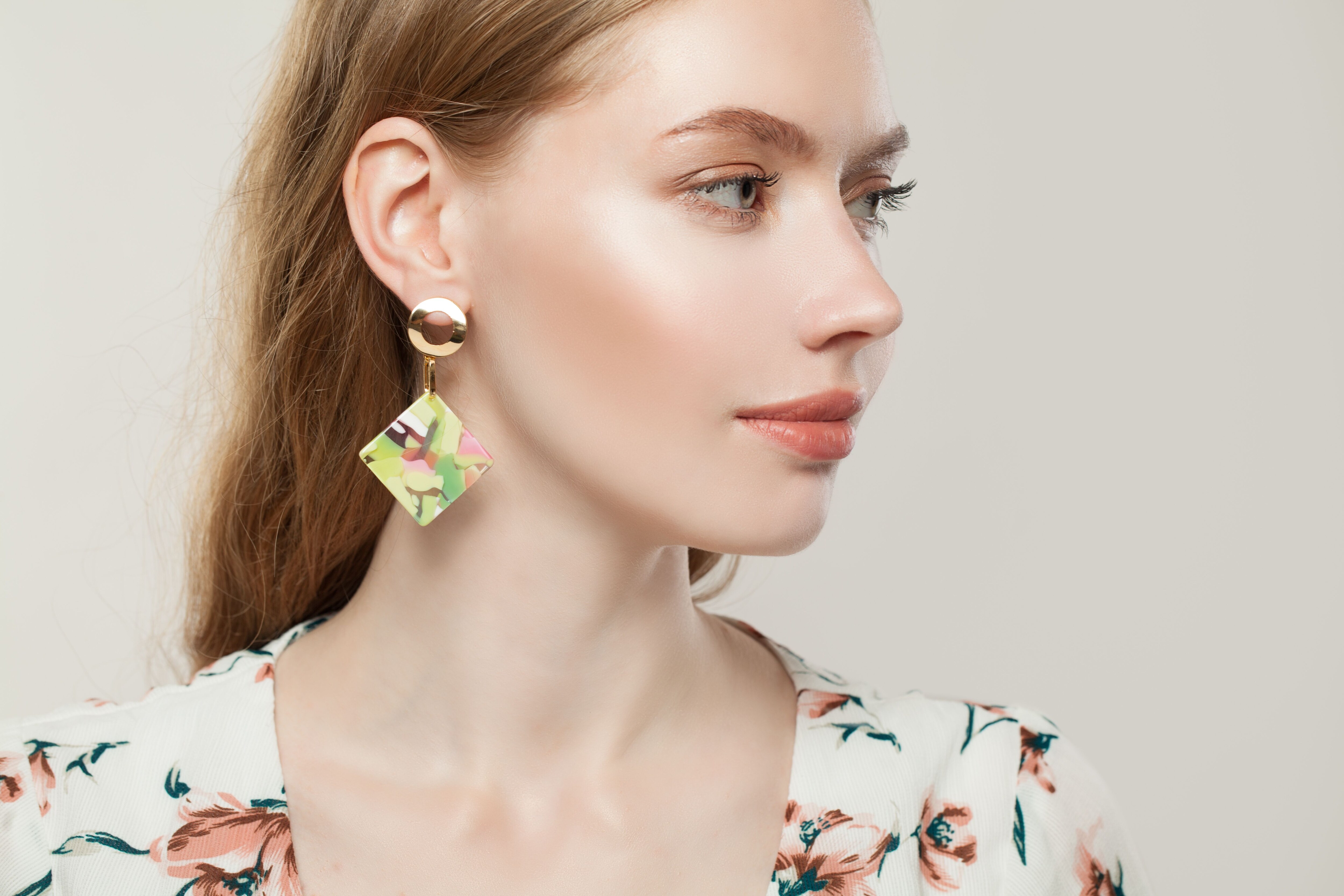 Beautiful woman wearing large statement earrings.jpeg
