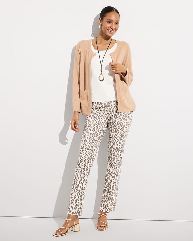 Woman wearing tan cardigan and leopard print pants