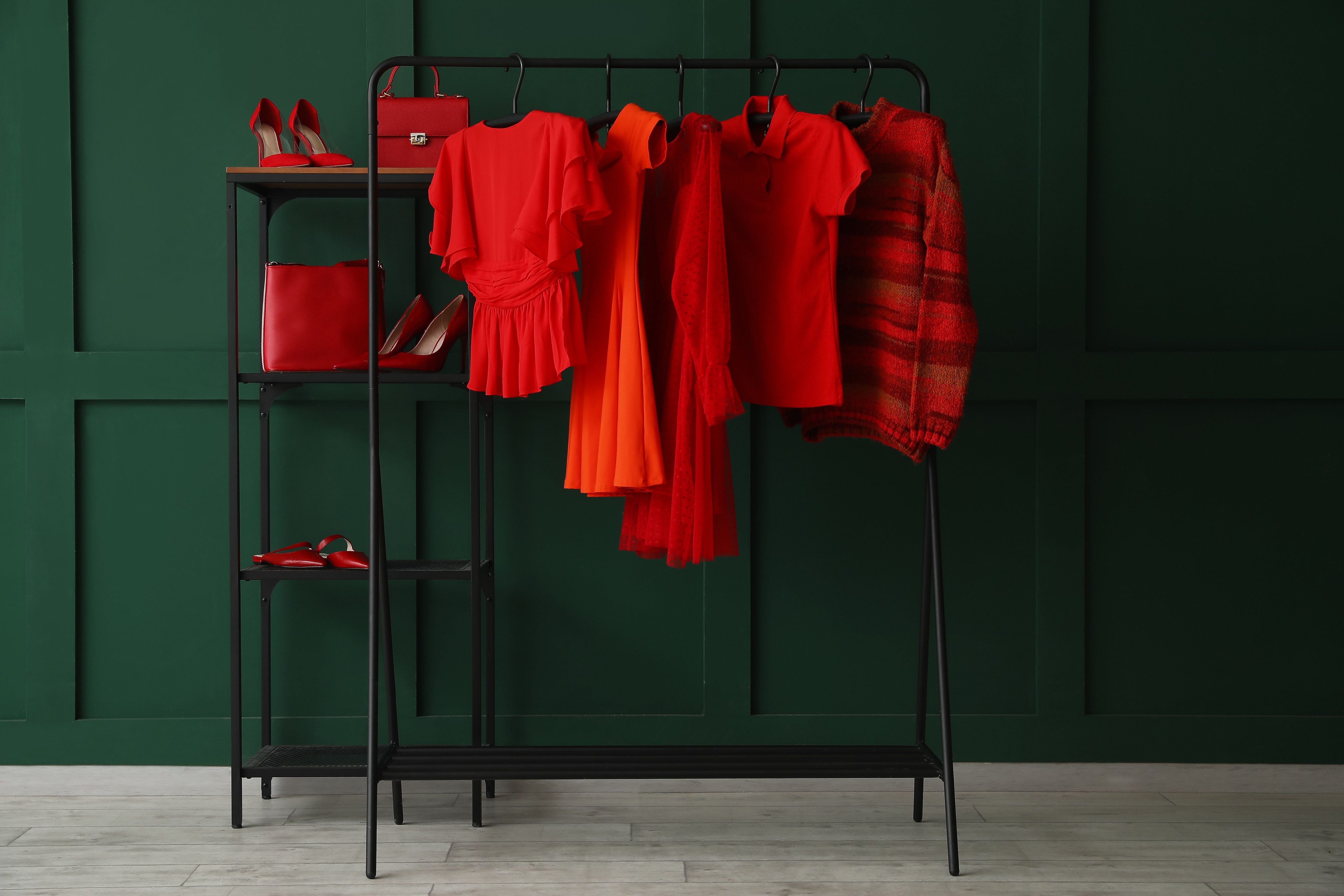 Red clothing hanging on a rack.jpeg