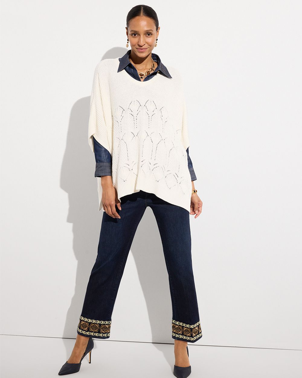 Woman wearing white slouchy top and black capris