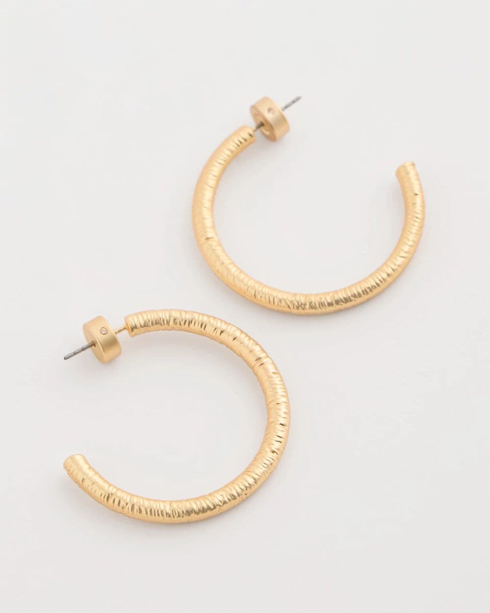 Goldtone Textured Hoop Earrings click to view larger image.