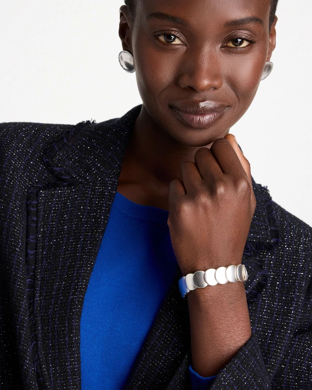 Semi-Bright Silvertone Flat Circle Stretch Bracelet click to view larger image.